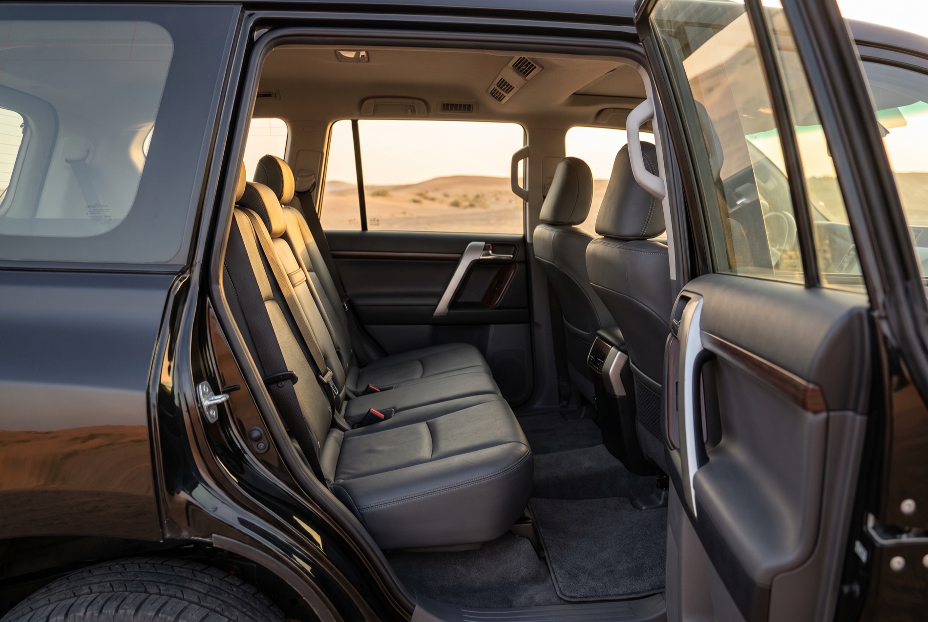 Rear bench of the Toyota Land Cruiser, out on the desert piste