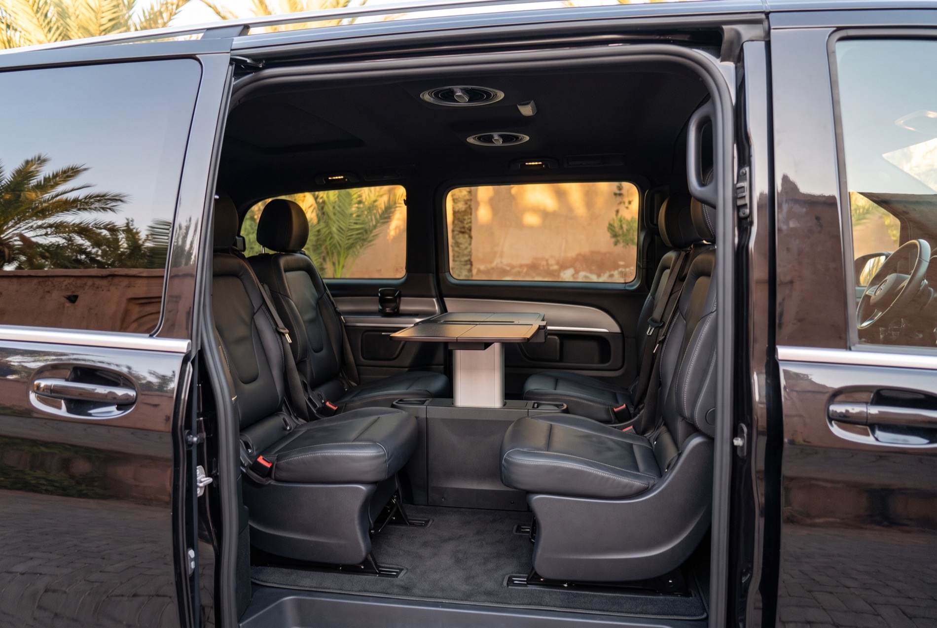 Rear cabin of the Mercedes-Benz V-Class, facing seats and a folding table
